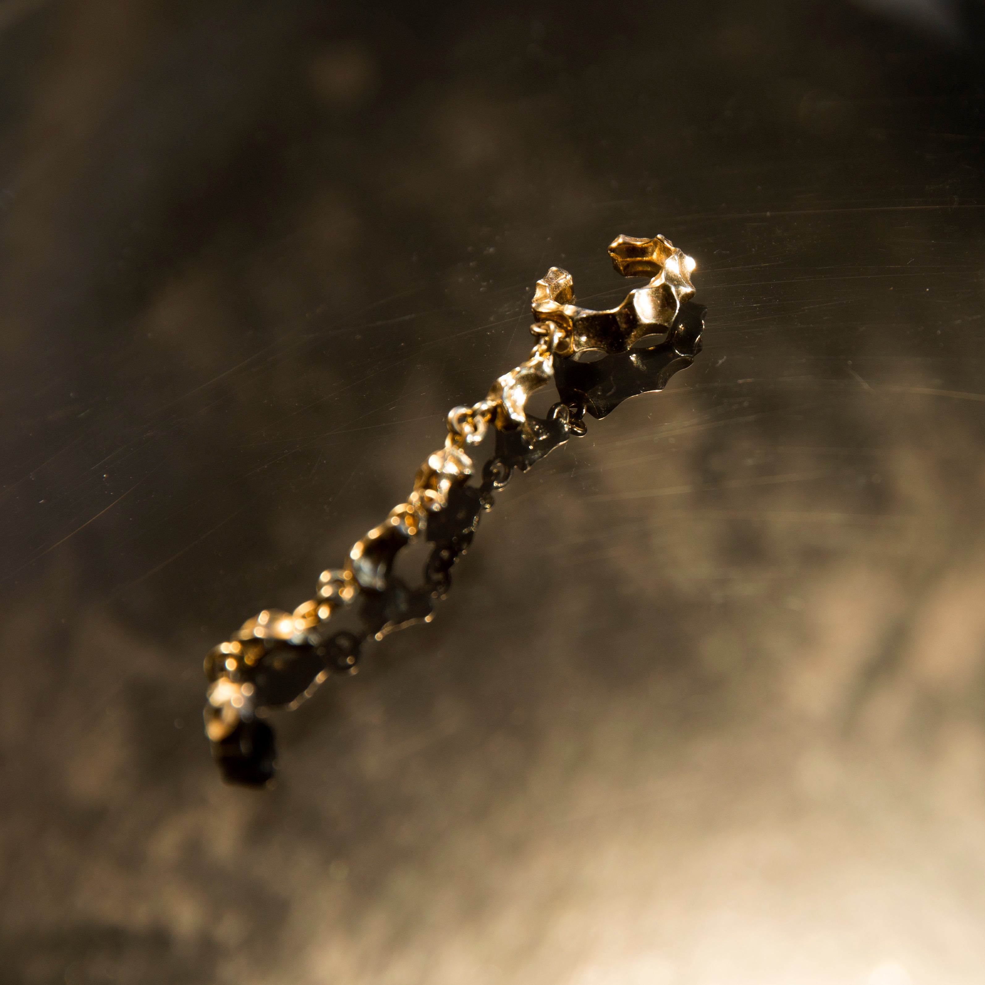 Stem, gold ear cuff