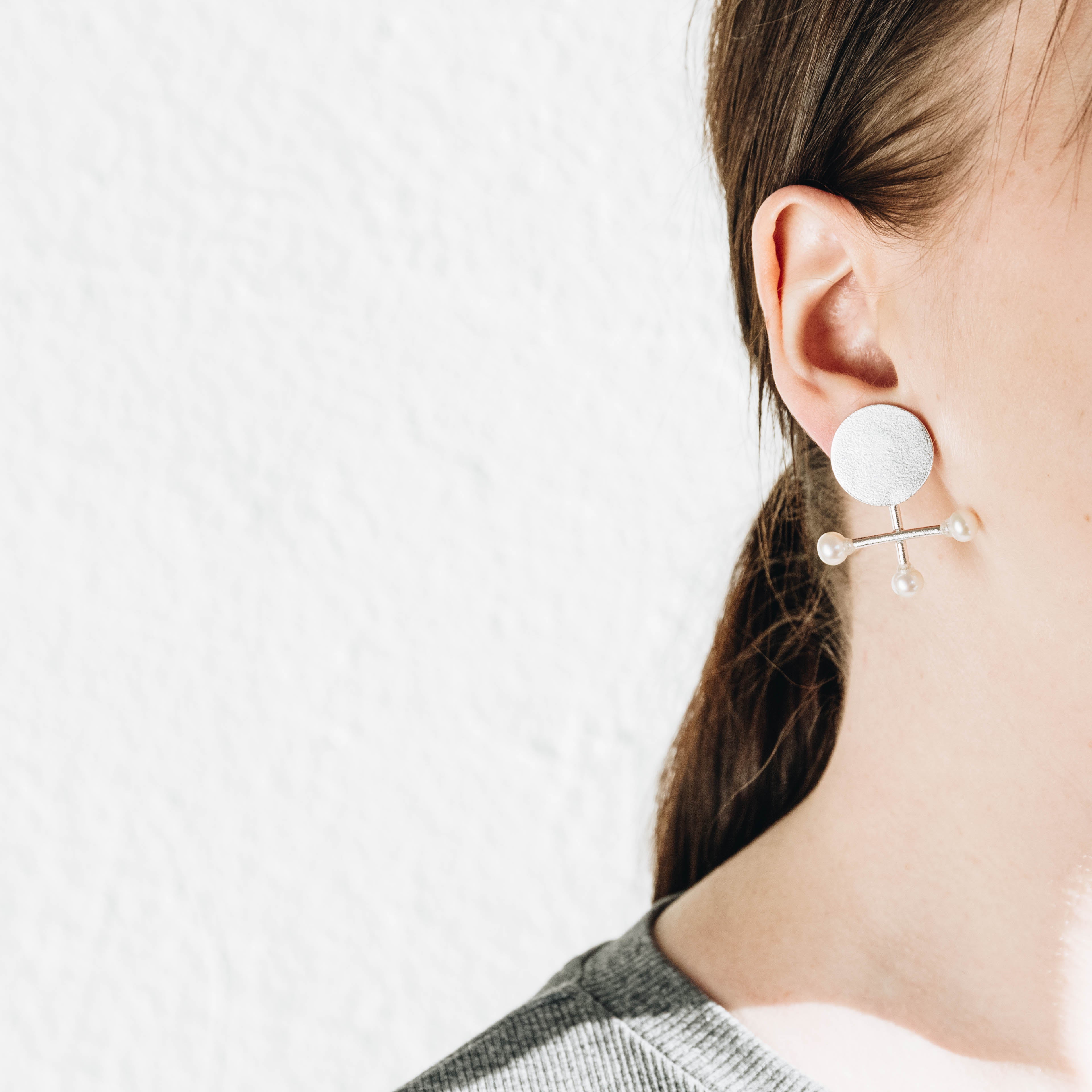 Composition, silver earrings