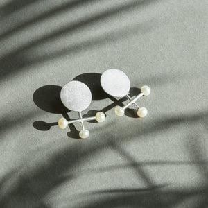 Composition, silver earrings