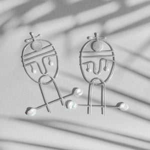 Portraiture, silver earrings